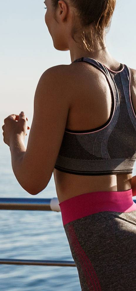Side profile of woman running outside