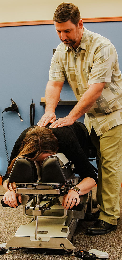 Woman getting a chiropractic adjustment