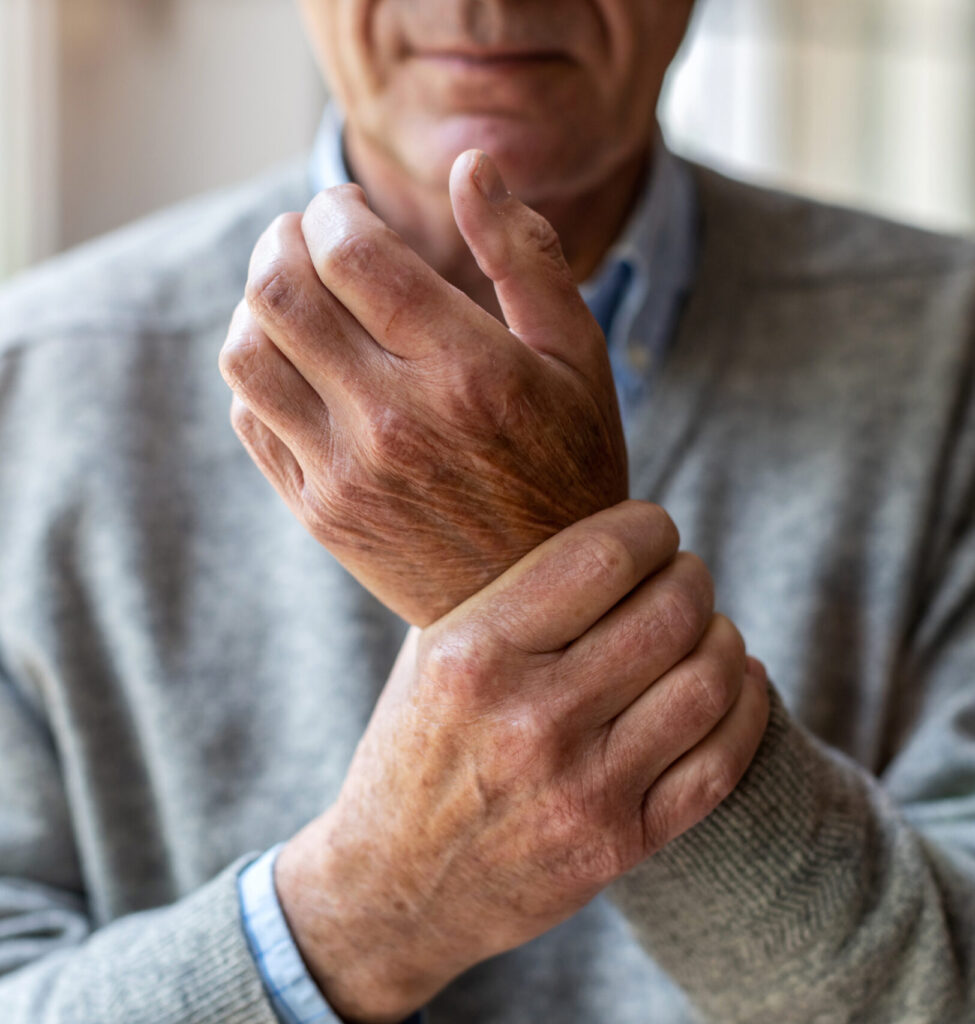 Elderly man with arthritis pain in wrist