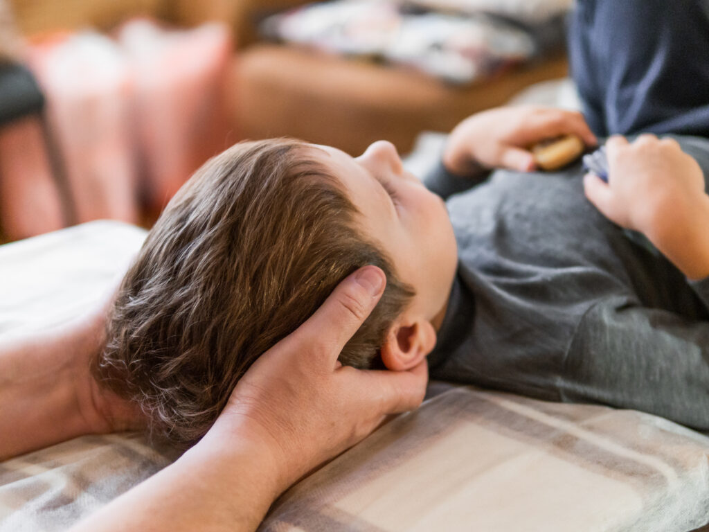 Child having a chiropractic adjustment