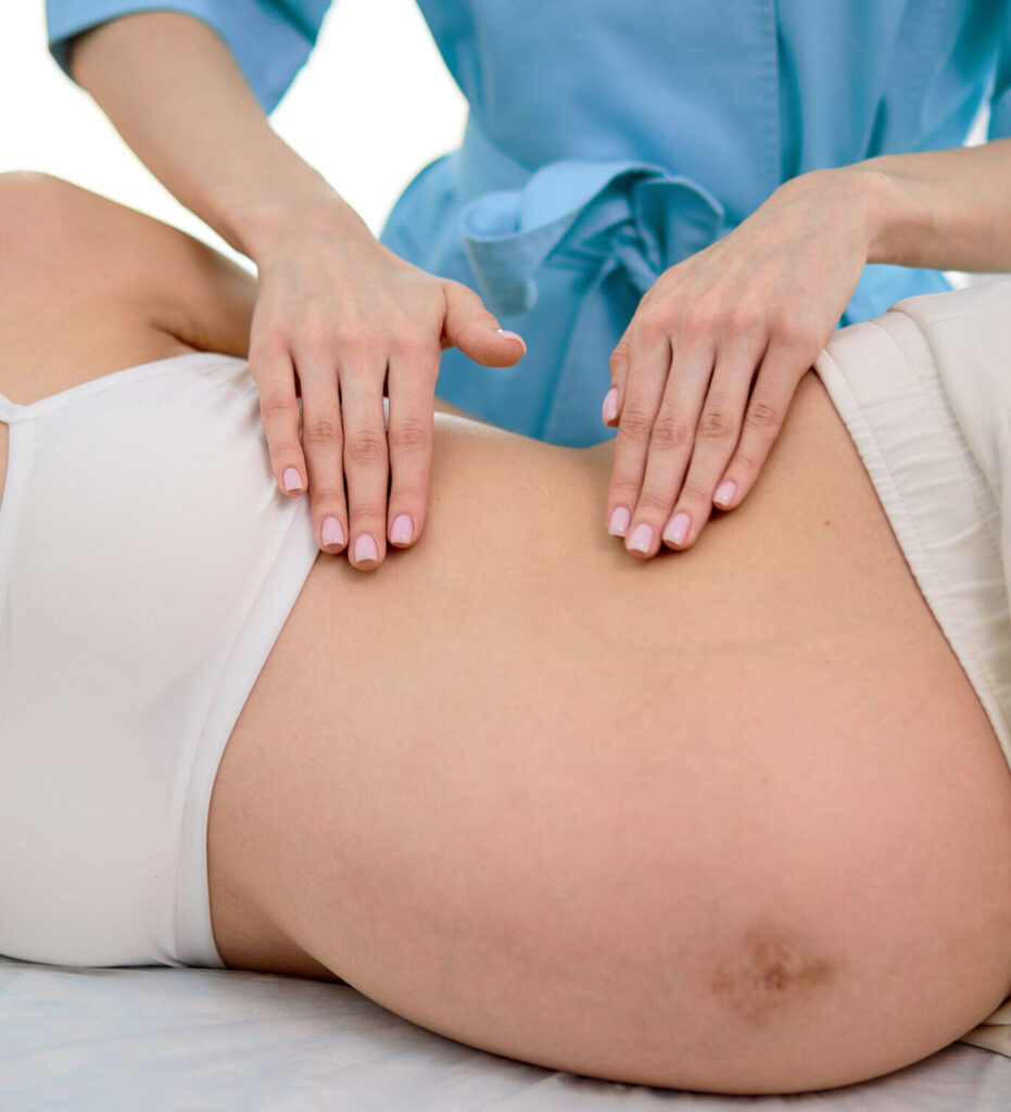 pregnant woman receiving chiropractic care