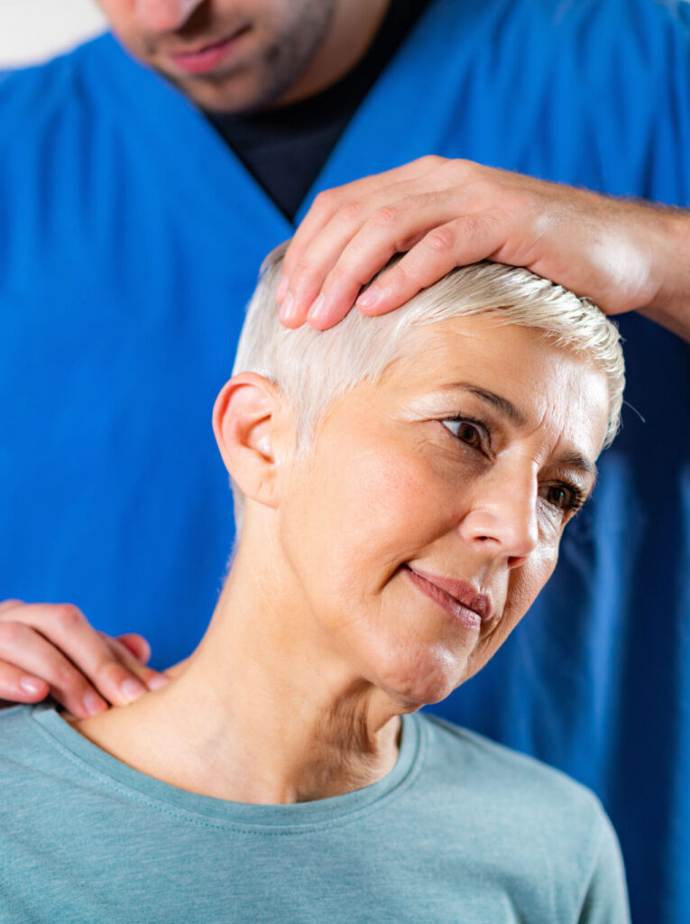 Woman getting treated for whiplash