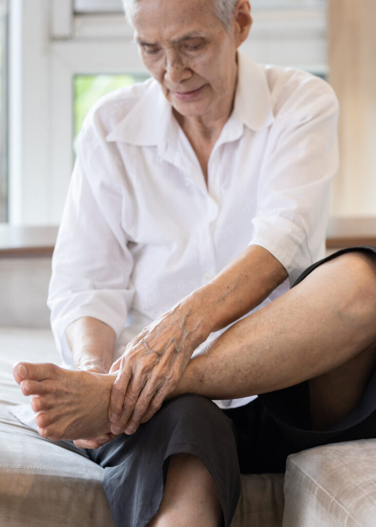 Elderly man dealing with neuropathy pain in foot