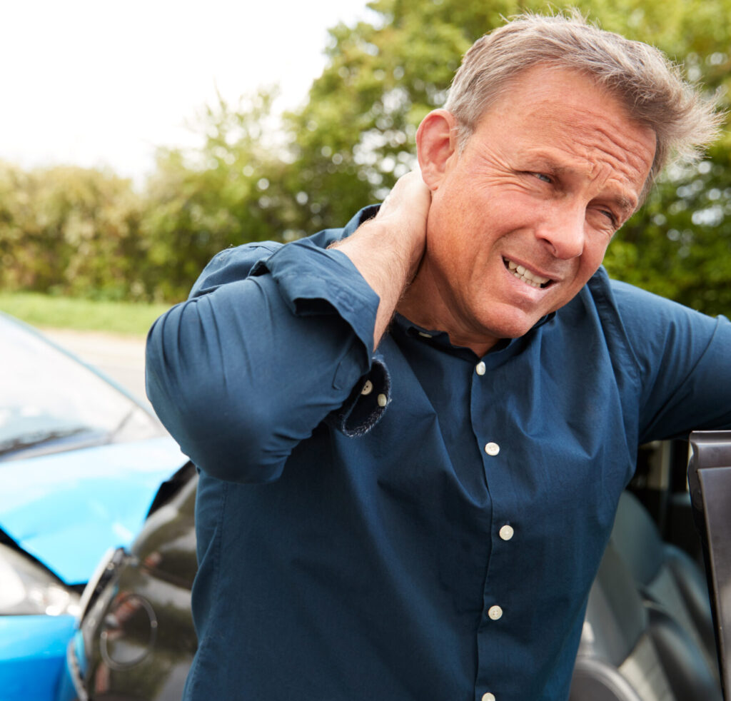 Man suffering from pain in neck from whiplash