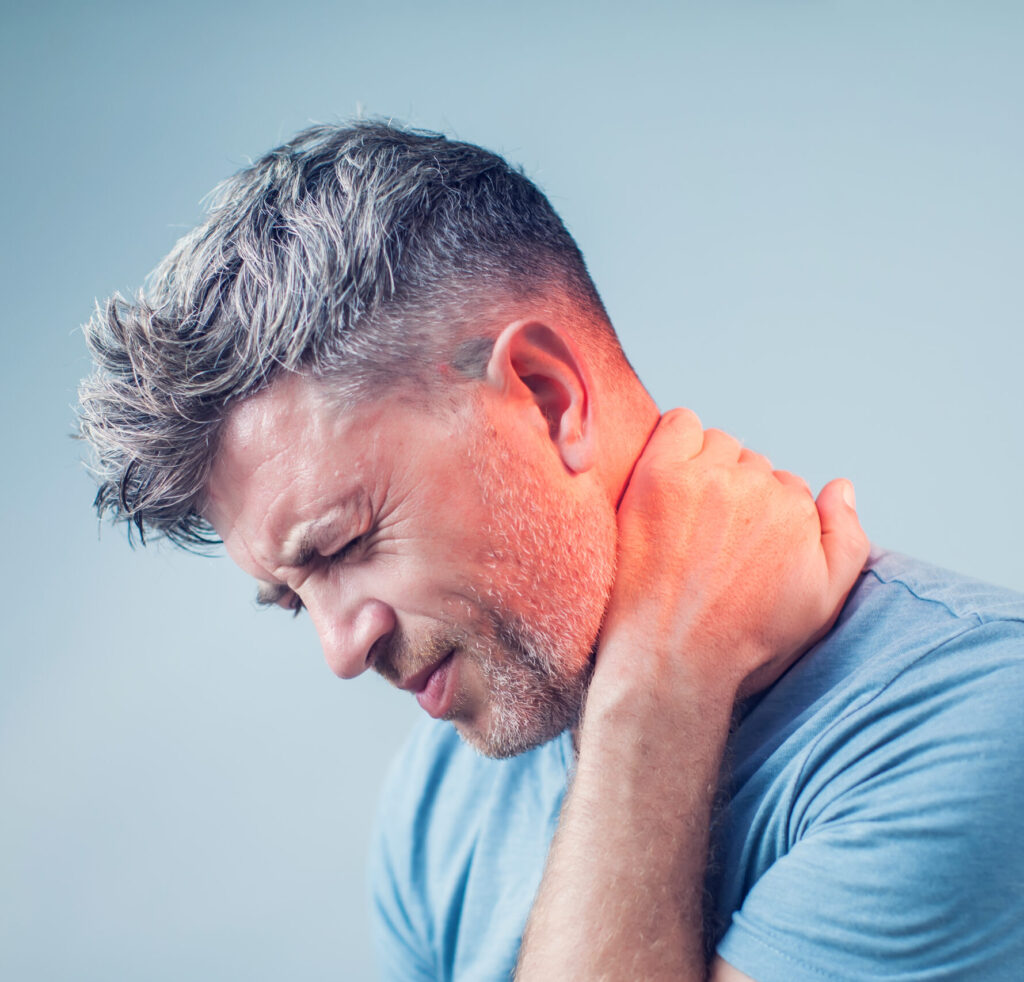 Side view of man with neck pain with red glow overlay on neck