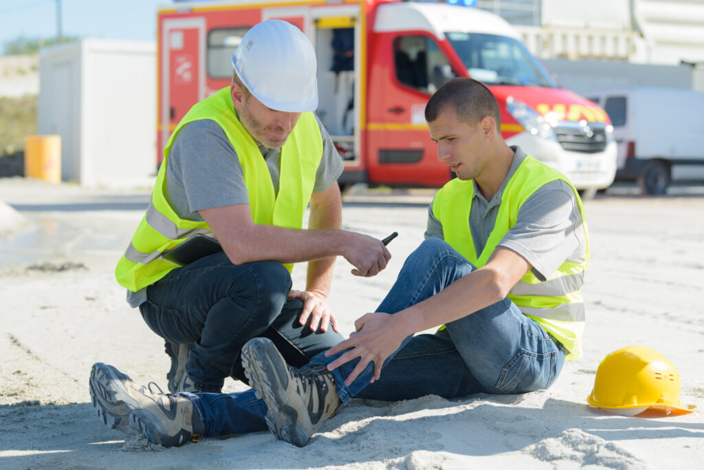 Construction worker with hyurt ankle at job site